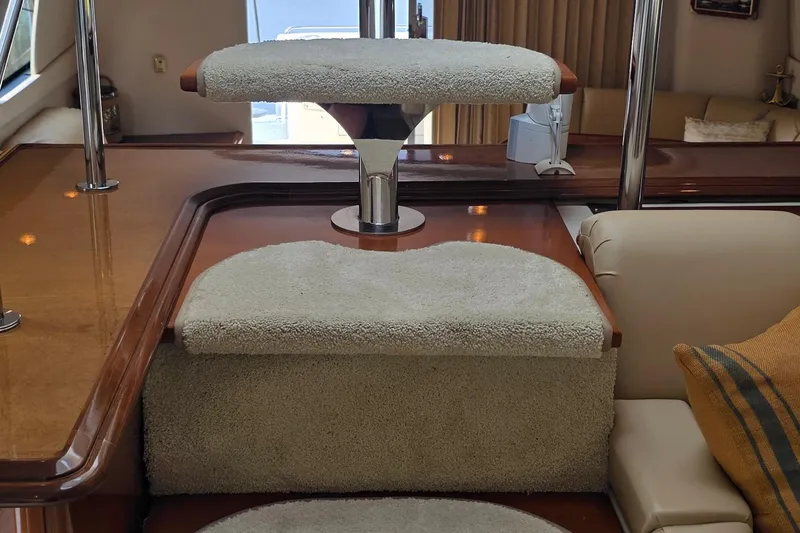 Slide: The Image of Interior of 2006 Carver 56 Voyager yacht with carpeted steps and elegant wood finish. - 56