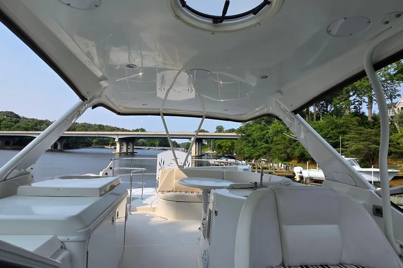 Slide: The Image of 2006 Carver 56 Voyager yacht interior with river and bridge view. - 57
