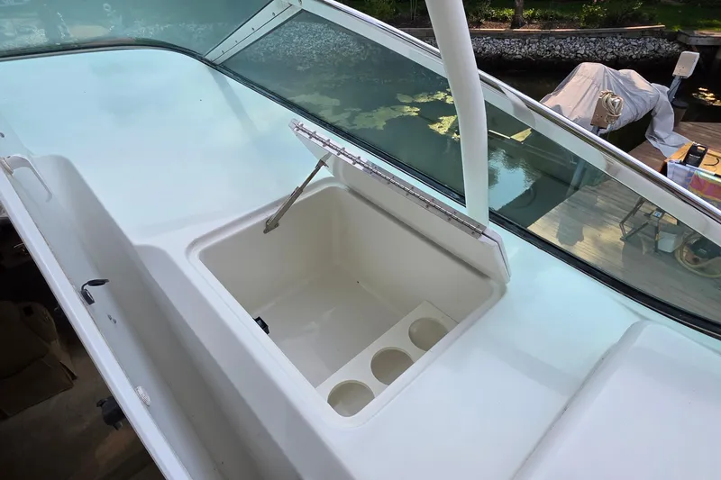 Slide: The Image of 2006 Carver 56 Voyager boat with open storage compartment on deck. - 60