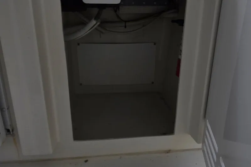 Slide: The Image of Empty storage compartment in a 2006 Carver 56 Voyager yacht. - 61