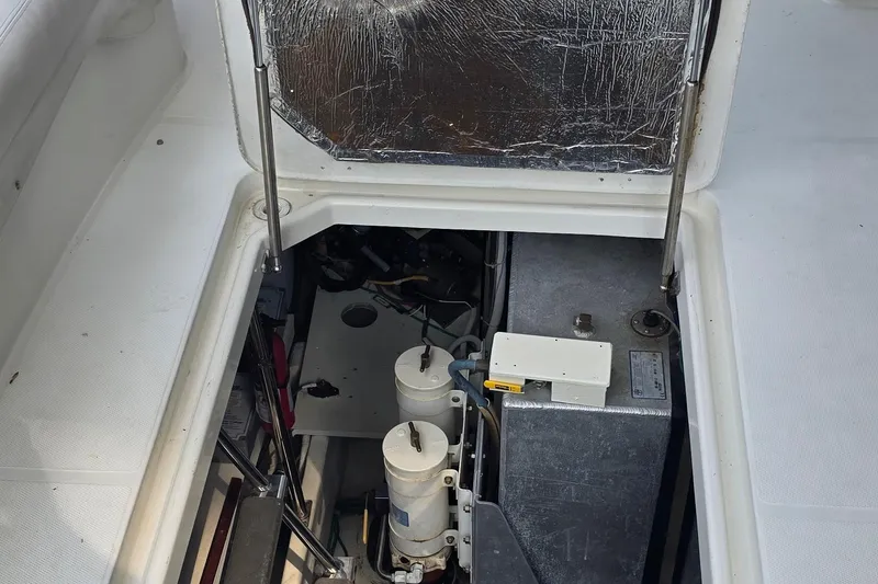 Slide: The Image of Engine compartment of a 2006 Carver 56 Voyager yacht, showcasing mechanical components. - 71