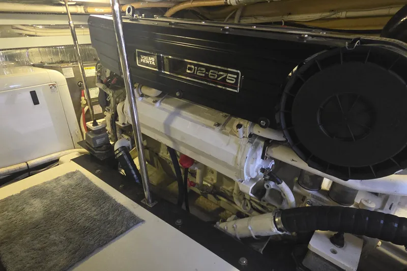 Slide: The Image of Engine room of a 2006 Carver 56 Voyager with Volvo Penta D12-675 engine. - 74