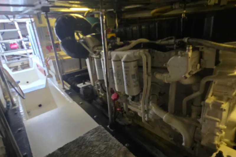 Slide: The Image of Engine room of a 2006 Carver 56 Voyager yacht, showcasing mechanical components. - 75