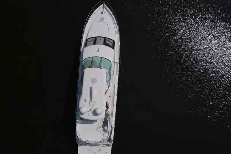 Slide: The Image of Aerial view of 2006 Carver 56 Voyager yacht on dark water. - 78