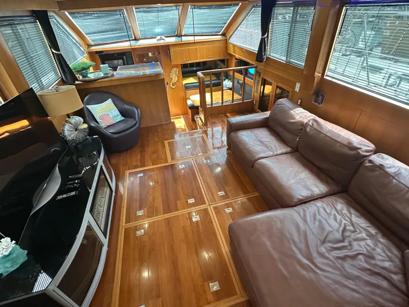 Slide: The Image of Luxurious interior of 2005 Jefferson Rivanna 50 SDMY yacht with leather seating and wood flooring. - 11