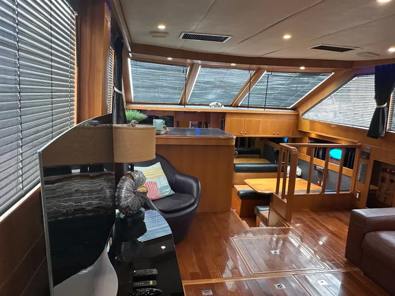 Slide: The Image of Luxurious interior of a 2005 Jefferson Rivanna 50 SDMY yacht with wood finishes and modern amenities. - 23