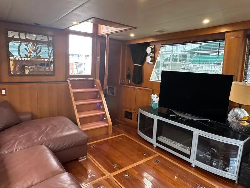 Slide: The Image of Luxurious interior of 2005 Jefferson Rivanna 50 SDMY yacht with leather seating and entertainment center. - 25