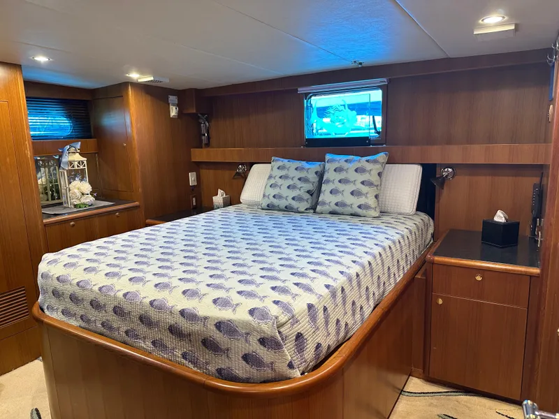 Slide: The Image of Luxurious bedroom interior of 2005 Jefferson Rivanna 50 SDMY yacht with wooden furnishings. - 27