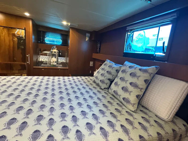 Slide: The Image of Luxurious bedroom interior of 2005 Jefferson Rivanna 50 SDMY yacht with patterned bedding. - 34