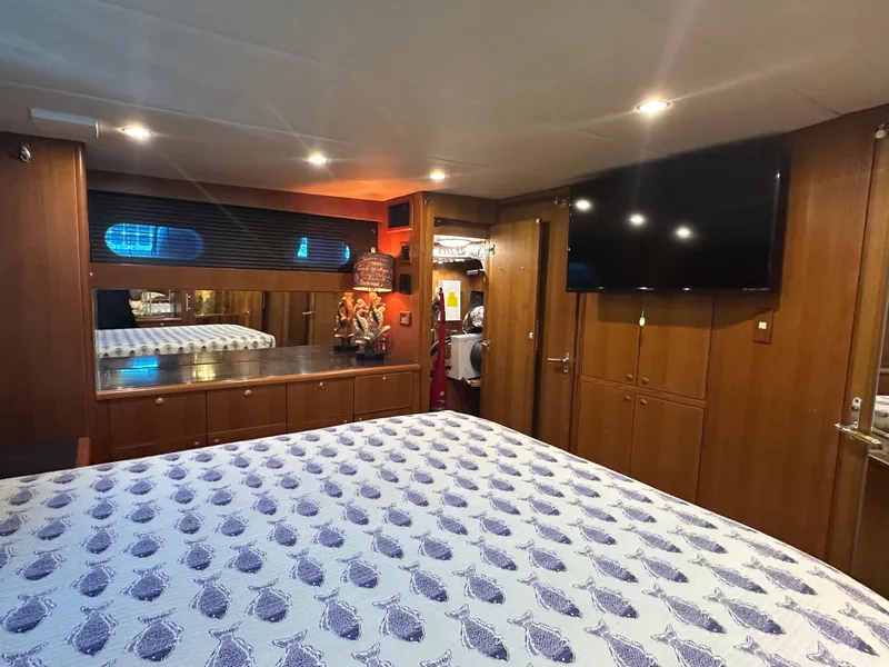 Slide: The Image of Luxurious bedroom interior of 2005 Jefferson Rivanna 50 SDMY yacht with modern amenities. - 35