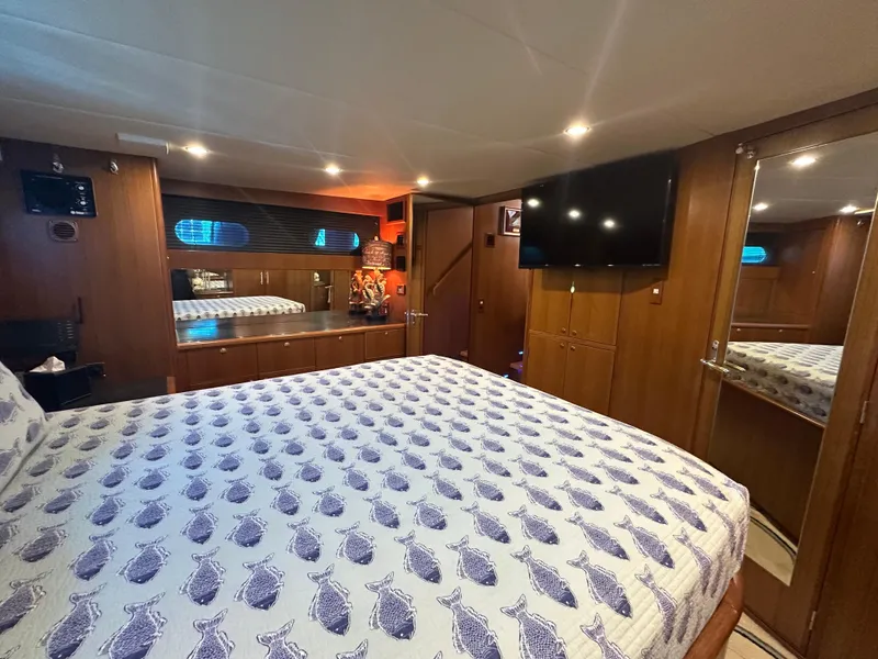 Slide: The Image of Luxurious bedroom interior of 2005 Jefferson Rivanna 50 SDMY yacht with elegant wood finishes. - 36