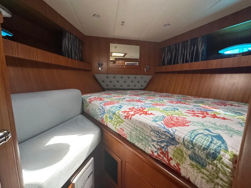 Slide: The Image of Luxurious cabin interior of 2005 Jefferson Rivanna 50 SDMY yacht with floral bedding. - 44