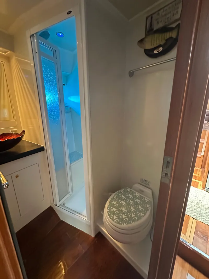 Slide: The Image of Bathroom interior of 2005 Jefferson Rivanna 50 SDMY yacht, featuring shower and toilet. - 48