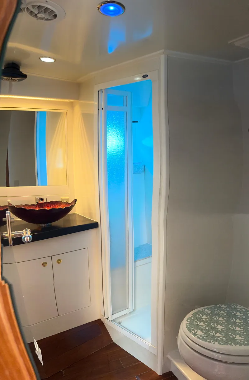 Slide: The Image of Luxurious bathroom in 2005 Jefferson Rivanna 50 SDMY yacht with modern fixtures and elegant design. - 49