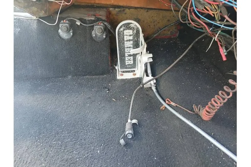 Slide: The Image of Interior of a 1994 Gambler 21 with wiring and foot pedal. - 12