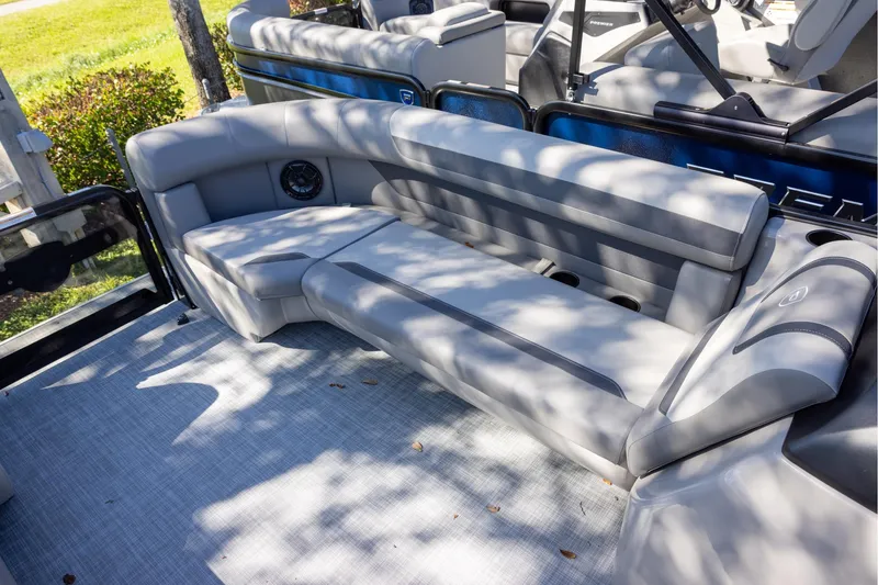 Slide: The Image of 2026 Premier 220 Sunscape RF boat interior with gray seating and modern design. - 12
