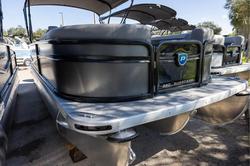 Slide: The Image of 2026 Premier 220 Sunscape RF pontoon boat, sleek design, docked outdoors. - 2