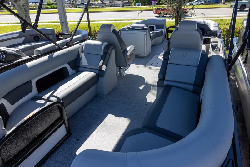 Slide: The Image of Luxurious interior of 2026 Premier 230 Solaris RF pontoon boat with spacious seating. - 3