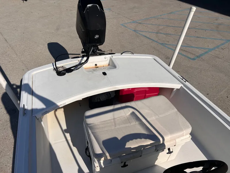 Slide: The Image of 2016 Mako Pro 17 Skiff CC boat interior with seating and storage compartments. - 7