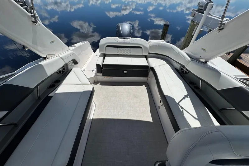 Slide: The Image of 2021 Regal 26 OBX boat interior with spacious seating and elegant design. - 17