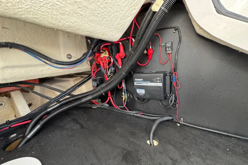 Slide: The Image of Electrical wiring and components inside a 2021 Regal 26 OBX boat. - 25
