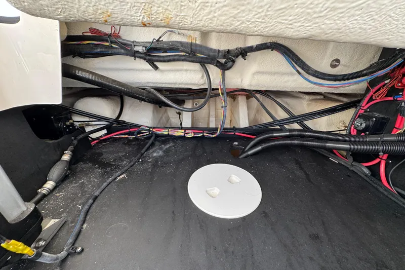 Slide: The Image of 2021 Regal 26 OBX boat interior wiring and components view. - 26