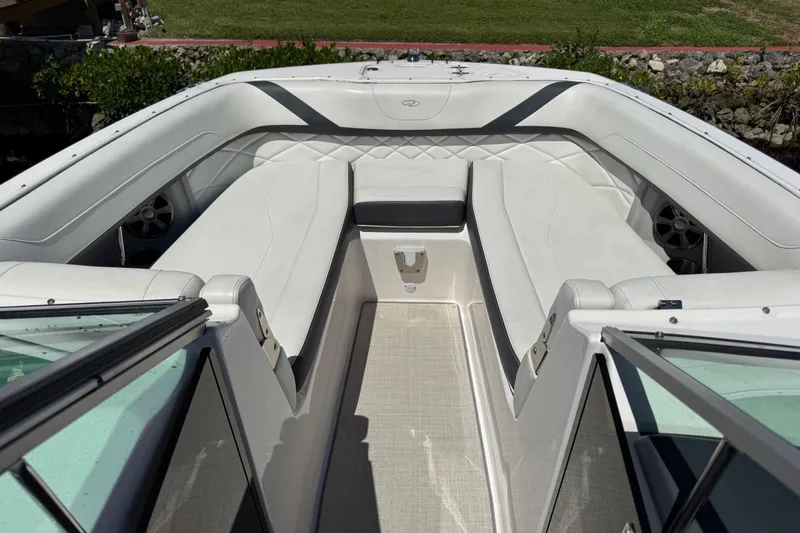 Slide: The Image of 2021 Regal 26 OBX boat interior with white seating and open deck. - 5