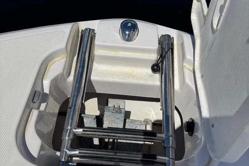 Slide: The Image of 2021 Regal 26 OBX boat ladder and storage compartment detail. - 8