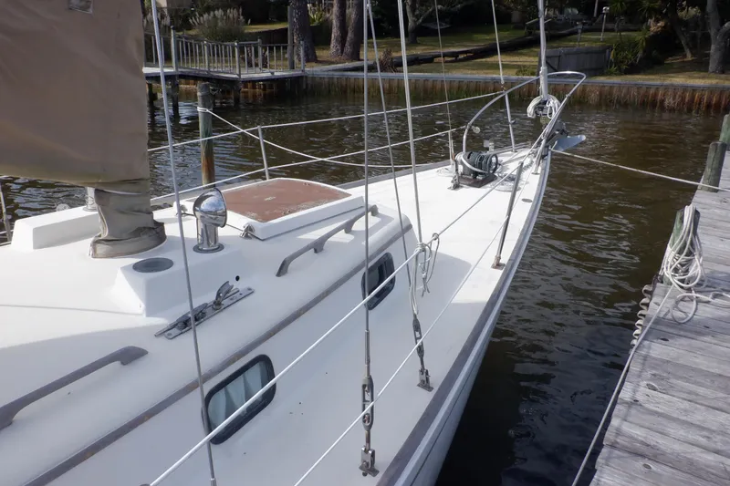 Slide: The Image of 1979 Bristol Yawl sailboat docked, showcasing deck and rigging details. - 10