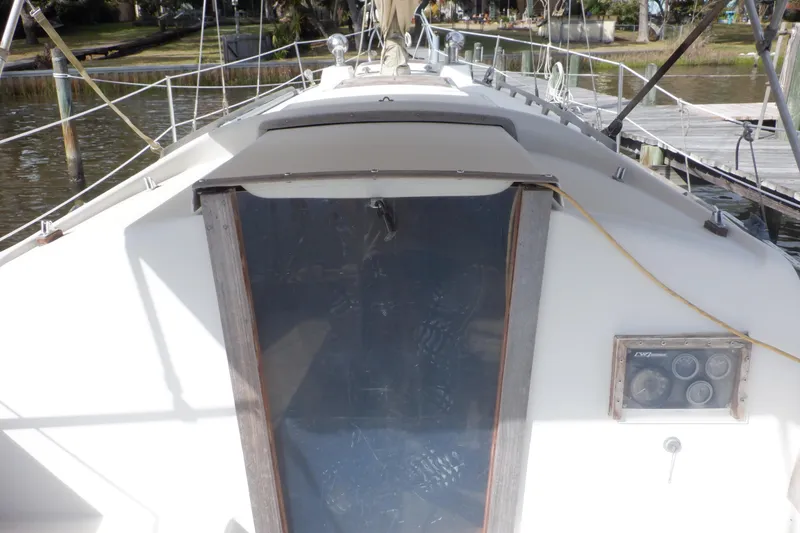 Slide: The Image of 1979 Bristol Yawl sailboat cockpit with wooden hatch and instrument panel. - 13