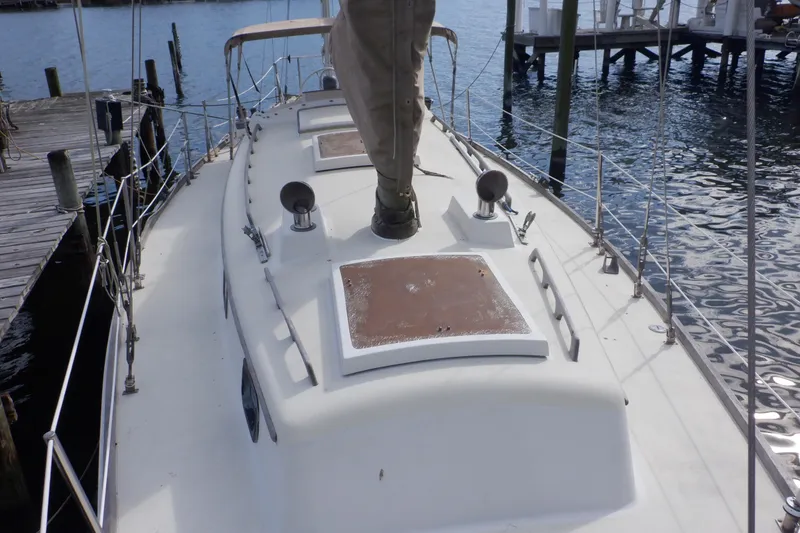 Slide: The Image of 1979 Bristol Yawl sailboat docked, showcasing deck and rigging details. - 8