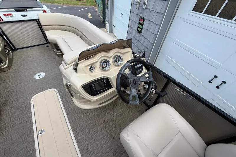 Slide: The Image of 2019 Avalon 2285 LSZ Cruise boat interior with steering wheel and seating. - 21