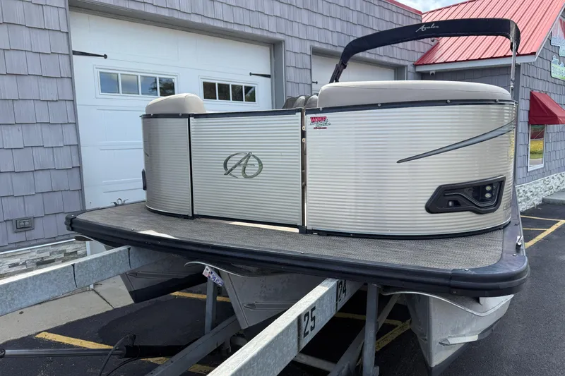 Slide: The Image of 2019 Avalon 2285 LSZ Cruise Tri-toon boat on trailer, parked outside a building. - 4