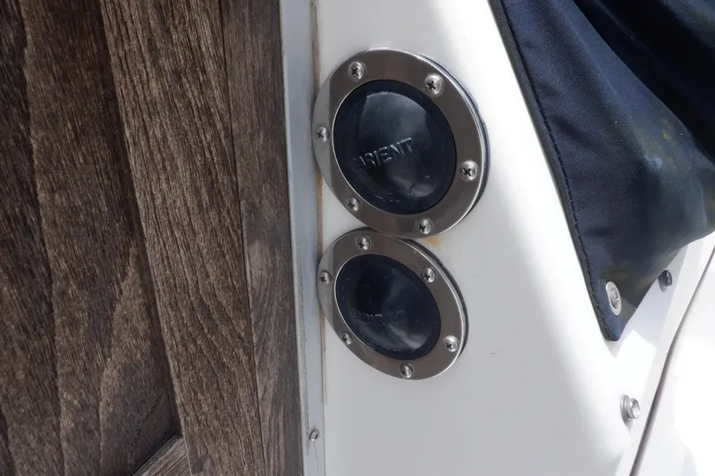Slide: The Image of Vent covers on a 1989 Hunter Vision 32 sailboat, featuring wood and metal details. - 10
