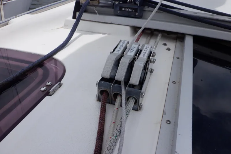 Slide: The Image of Close-up of rope clutches on a 1989 Hunter Vision 32 sailboat deck. - 11