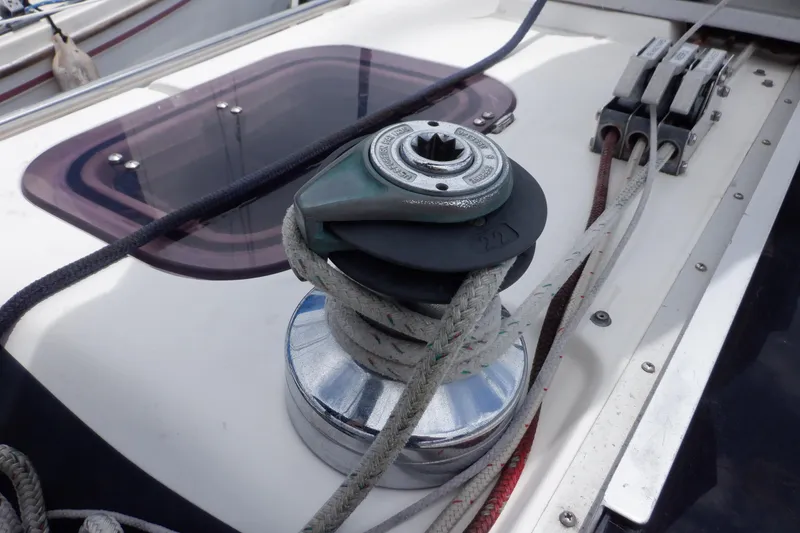 Slide: The Image of Winch and ropes on 1989 Hunter Vision 32 sailboat deck. - 13