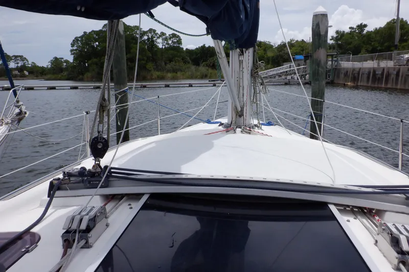 Slide: The Image of 1989 Hunter Vision 32 sailboat docked in a marina, view from the deck. - 14