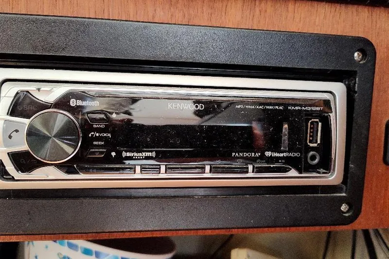 Slide: The Image of Kenwood stereo system in a 1989 Hunter Vision 32 boat, featuring Bluetooth and USB connectivity. - 37