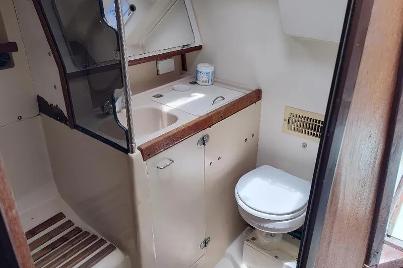 Slide: The Image of Interior of 1989 Hunter Vision 32 sailboat bathroom with sink and toilet. - 38