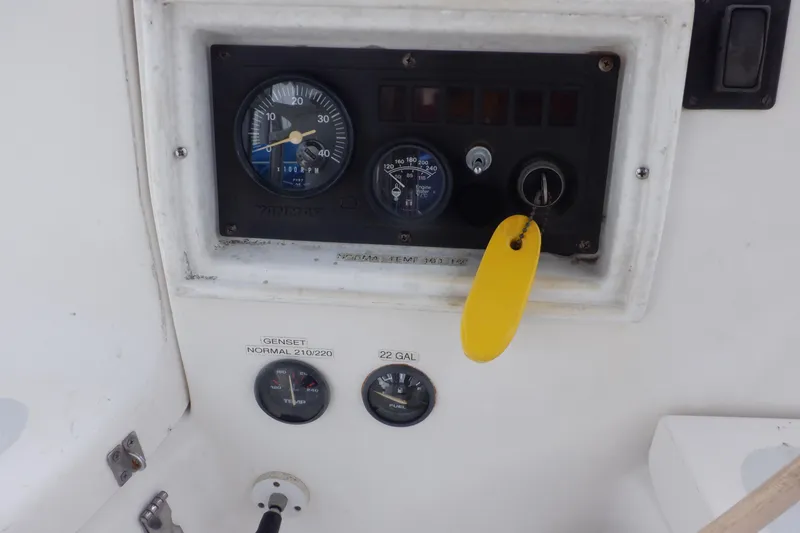 Slide: The Image of Control panel of a 1989 Hunter Vision 32 sailboat with gauges and key. - 4