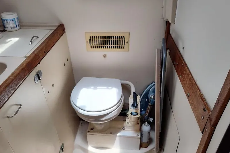 Slide: The Image of Compact bathroom in 1989 Hunter Vision 32 sailboat with toilet and sink. - 40