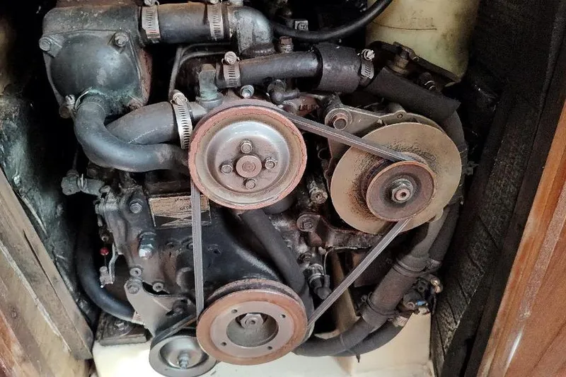 Slide: The Image of Engine of a 1989 Hunter Vision 32 sailboat, showing belts and components. - 41