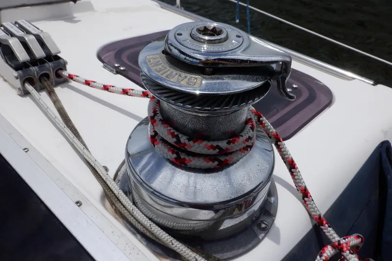 Slide: The Image of Winch and ropes on 1989 Hunter Vision 32 sailboat deck. - 9