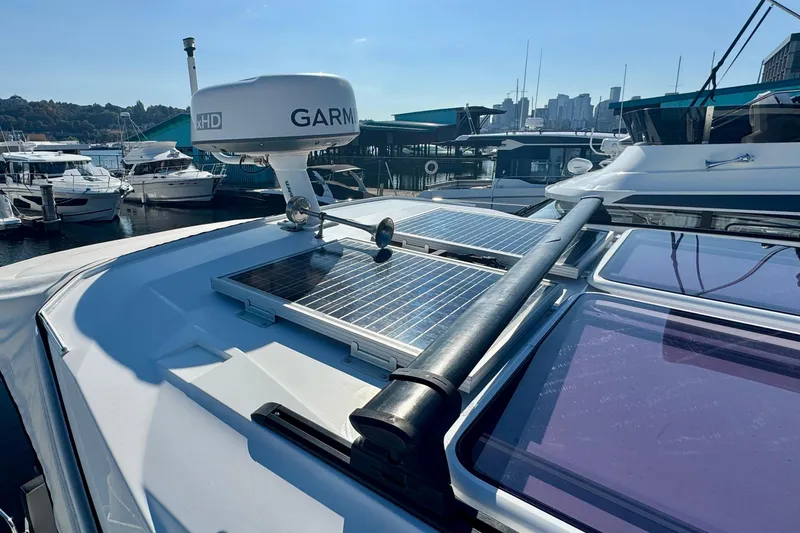 Slide: The Image of 2020 Jeanneau NC 895 boat with solar panels and Garmin radar at marina. - 29