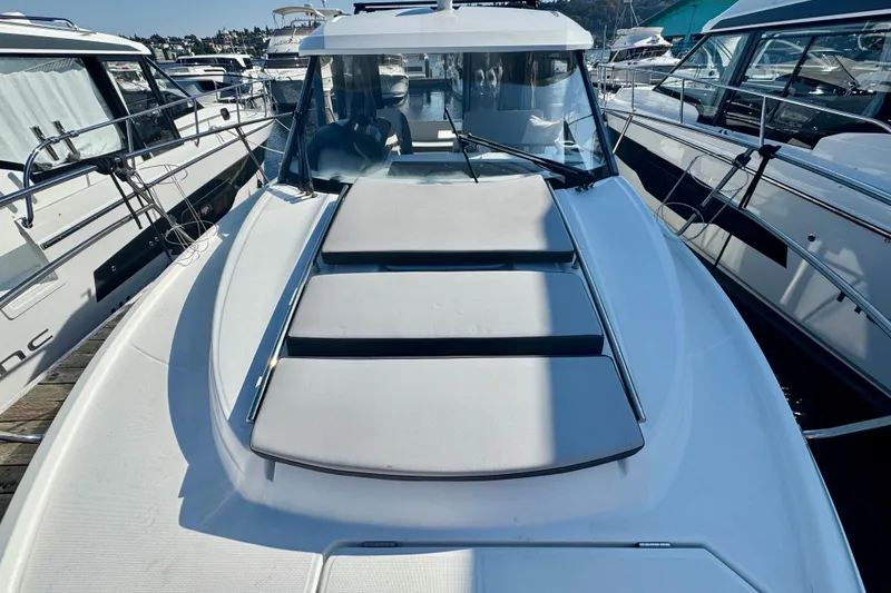 Slide: The Image of 2020 Jeanneau NC 895 boat docked, featuring sleek design and spacious deck area. - 30