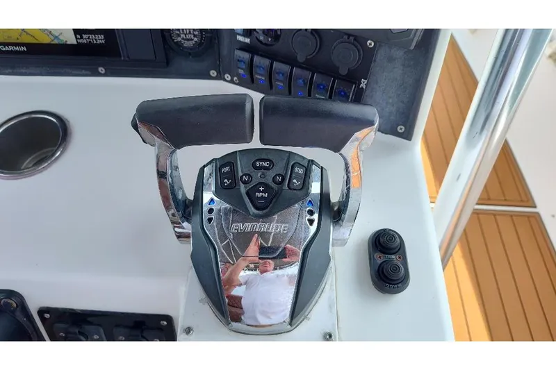 Slide: The Image of Throttle controls on a 1995 Ocean Master 31 Center Console boat dashboard. - 12
