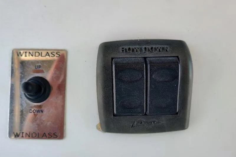 Slide: The Image of Windlass and bow down controls on 1995 Ocean Master 31 Center Console boat. - 13