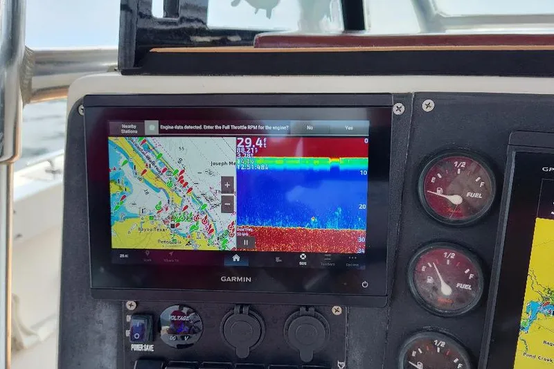Slide: The Image of Garmin navigation display on 1995 Ocean Master 31 Center Console boat dashboard. - 16