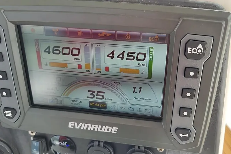 Slide: The Image of Evinrude boat dashboard displaying RPM, speed, and fuel economy on Ocean Master 31 Center Console. - 20
