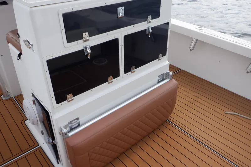Slide: The Image of 1995 Ocean Master 31 Center Console with teak deck and storage compartments. - 27